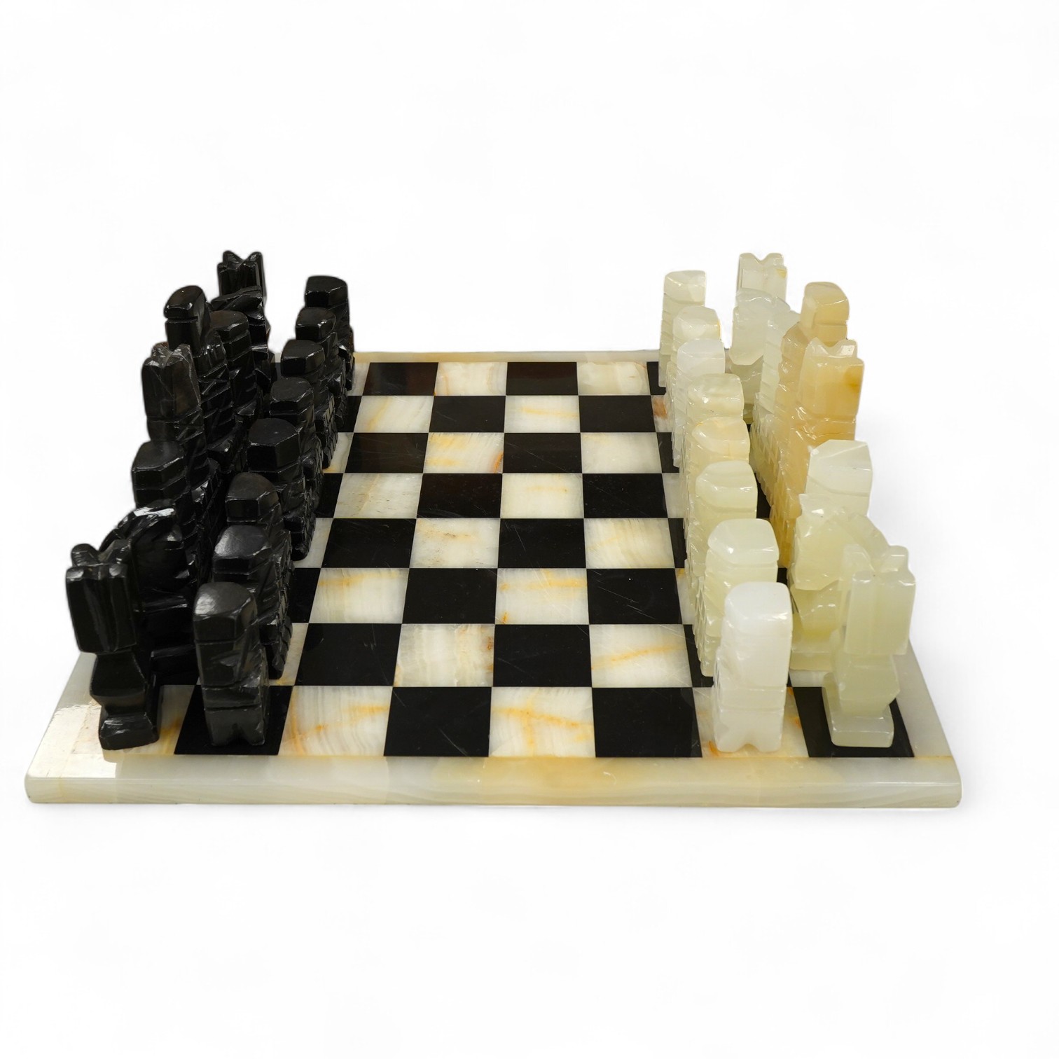 A black and white onyx chess set and board, largest piece, 14cm high